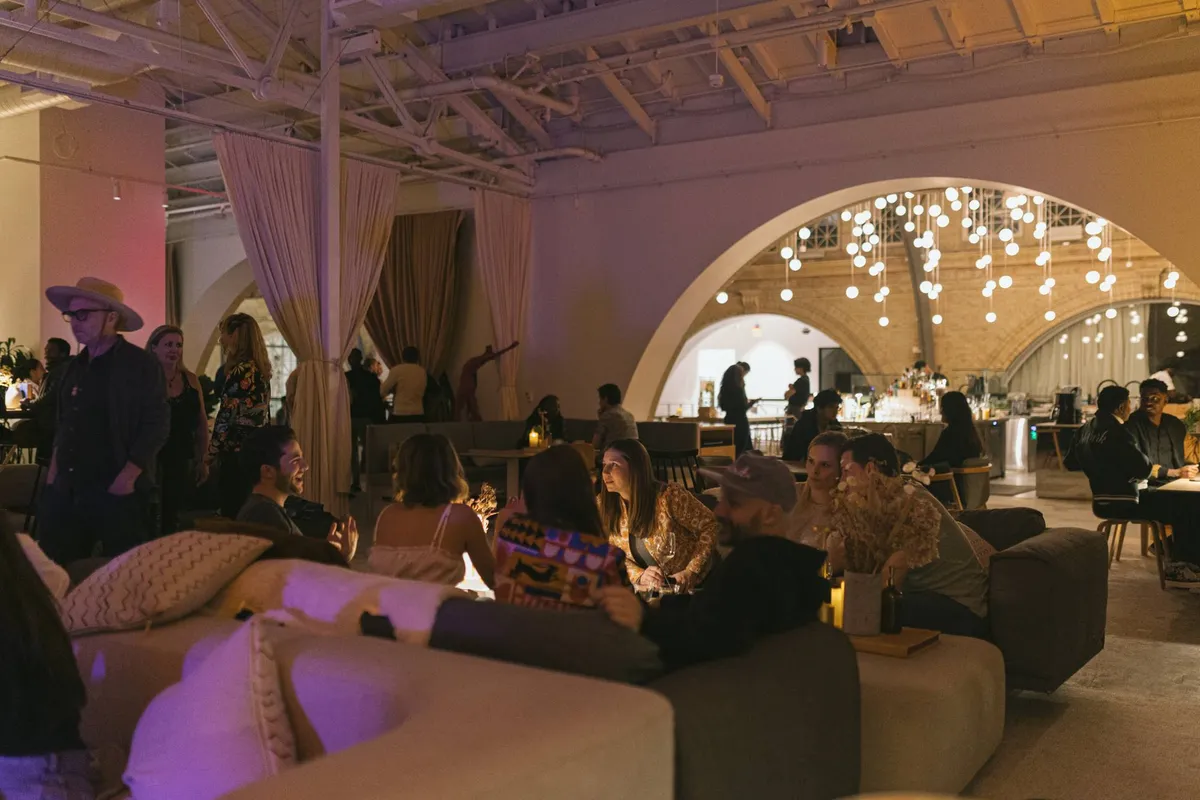 SHACK15's evening ambiance with modern lounge seating and ambient lighting